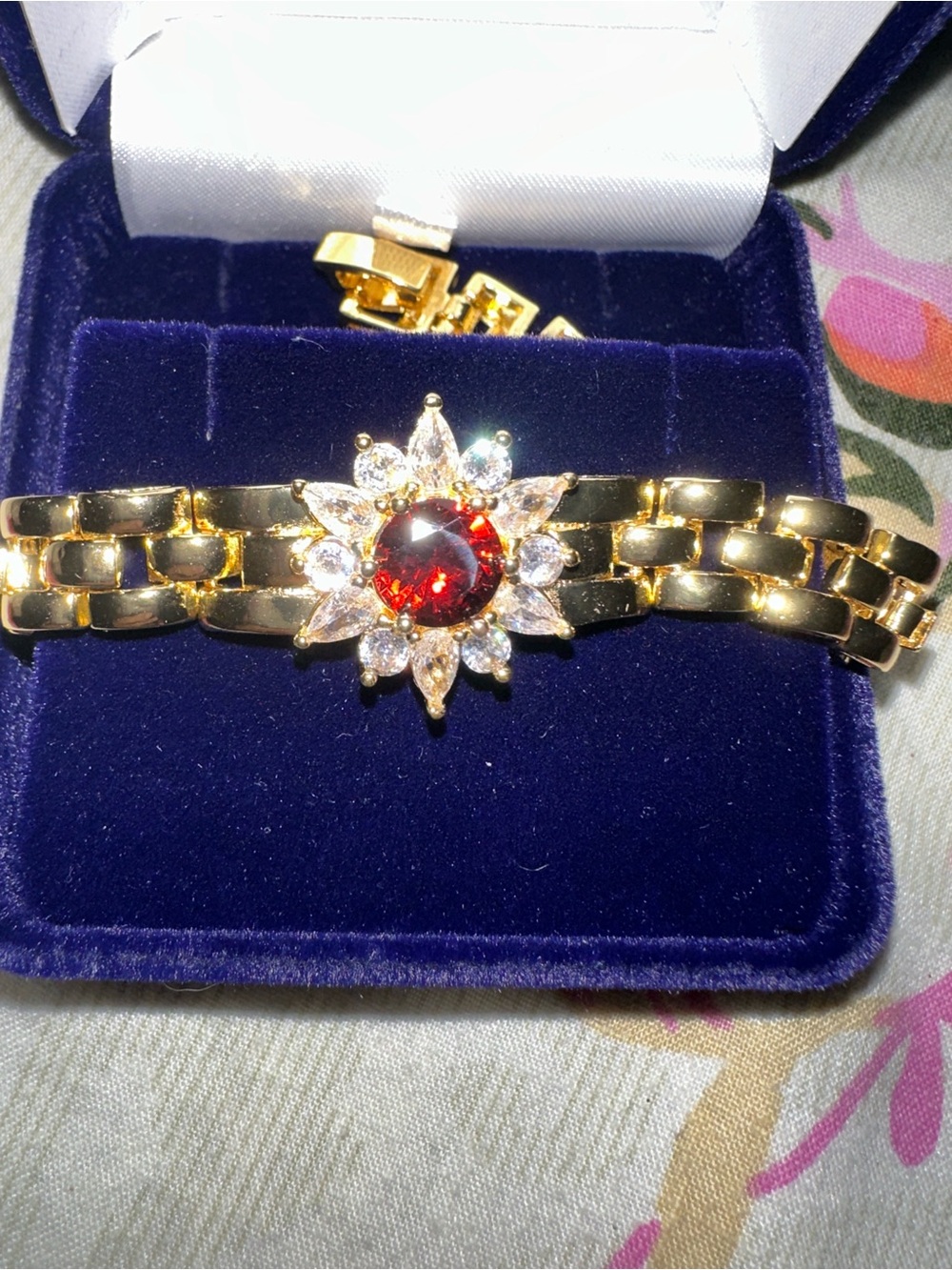 Gold-Tone Sunburst Bracelet with Red Center Stone